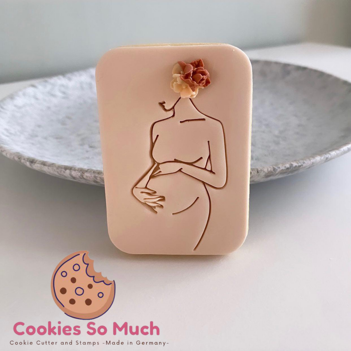 Sello y cortador de mujer embarazada.
