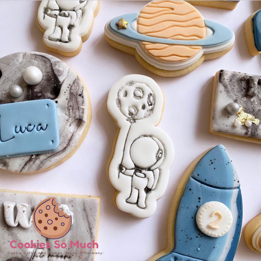 Astronaut mit Planet Stempel und Ausstecher