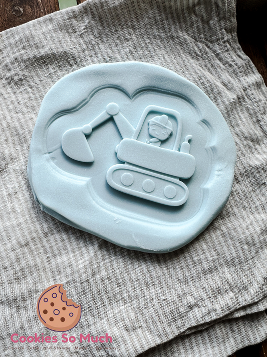 Bagger mit Jungen Model 1 debosser und ausstecher