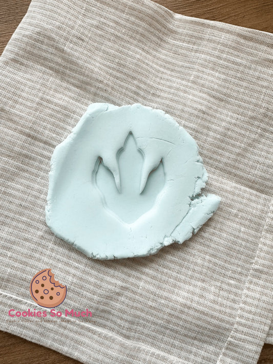 Sello de huella de dinosaurio